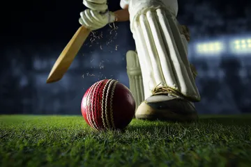 A woman smiling by bright slot machines showing lucky symbols, showcasing the exciting slot offerings at KRIKYY.
