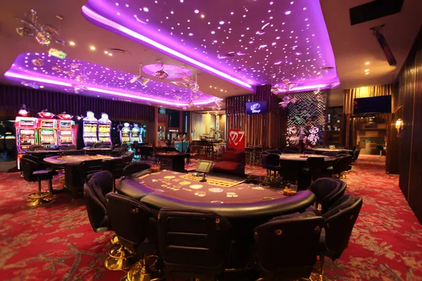 A laptop glowing with a bright login prompt in a minimalistic setup, symbolizing the protected access system at KRIKYY.